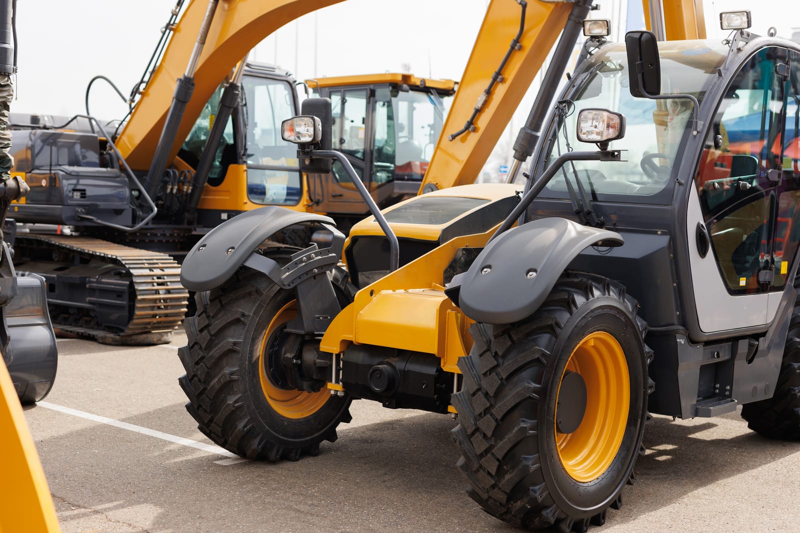 Row of mini excavators at a dealer
